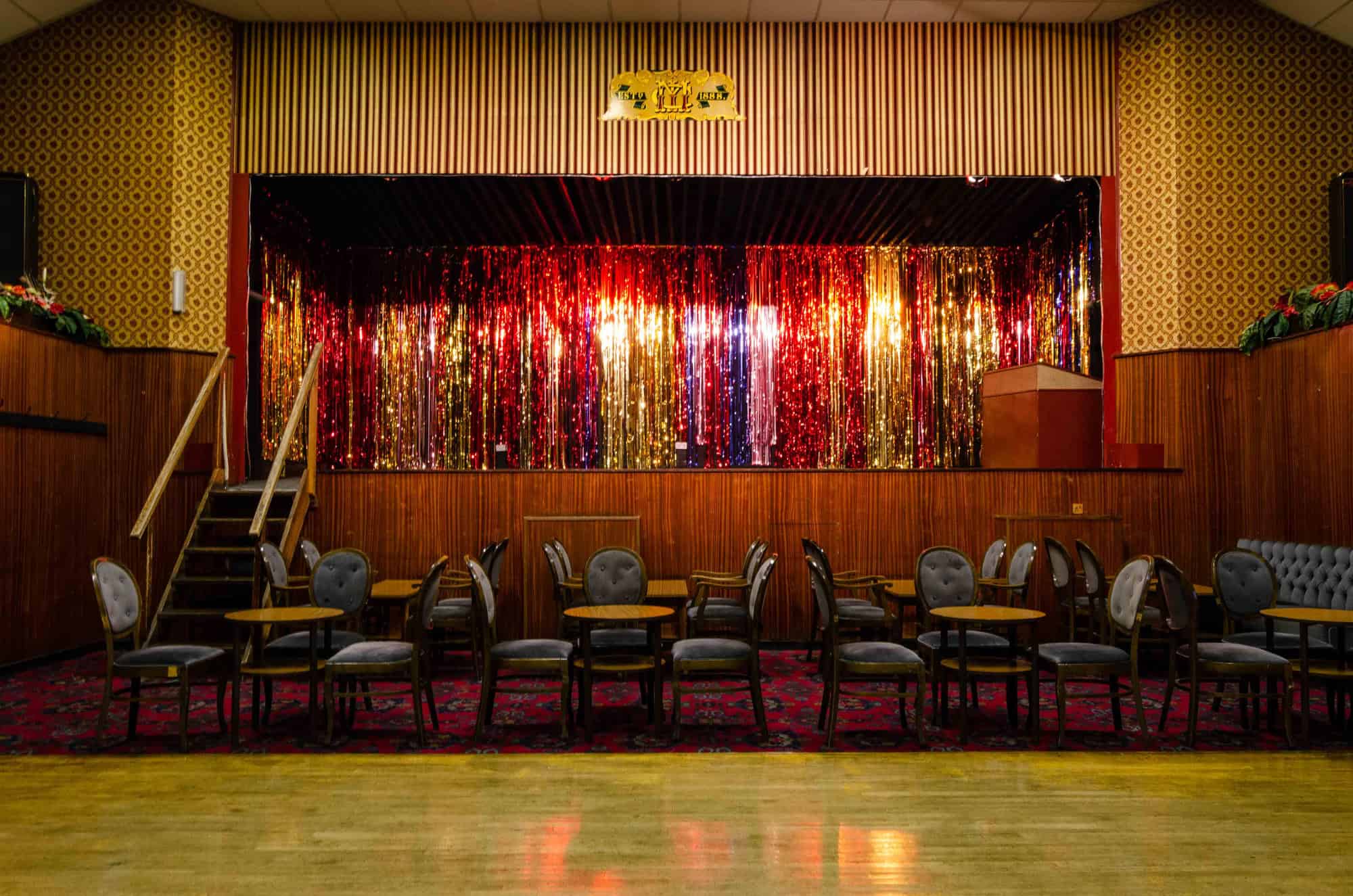 Working Mens Club N16 - An original working mens club. Glitter curtains, dart boards, snooker tables. An incredible location for photoshoots and filming - The Location Guys